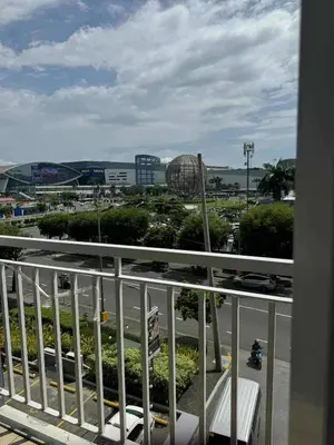 a balcony with a view of a parking lot at Chic Retreat in Pasay City - Scandinavian with Balcony facing Mall Of Asia in Manila