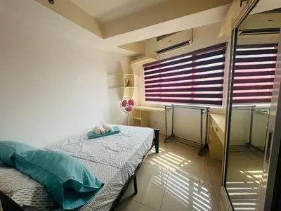 a small room with a bed and a window at Xenial Pasay City Apartment for Rent - Entire House Front of Mall of Asia in Manila