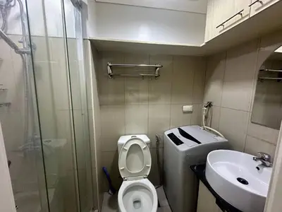 a small bathroom with a toilet and a sink at Xenial Pasay City Apartment for Rent - Entire House Front of Mall of Asia in Manila
