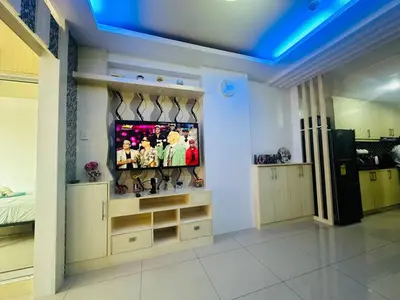 a room with a tv in a room at Xenial Pasay City Apartment for Rent - Entire House Front of Mall of Asia in Manila