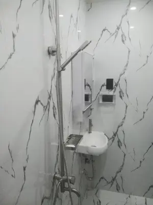 a bathroom with a sink and a mirror at Navio Transient House in Cabuyao