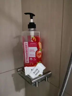 a bottle of mouthwash sitting on a shelf in a bathroom at Fancy Pasay City Apartment for Rent - Mall of Asia Nearby front of Mall Of Asia in Manila