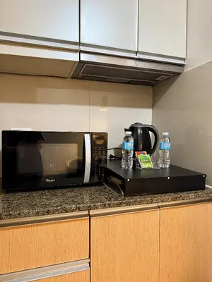 a microwave sitting on top of a kitchen counter at Kai cabins WALKING DISTANCE NAIA 3 AIRPORT NEWPORT CITY in Manila