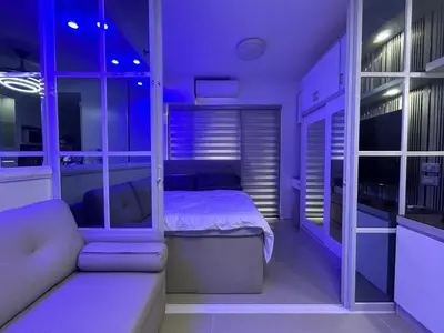 a bedroom with a bed and a couch in a room at Esthetic vibes in Manila