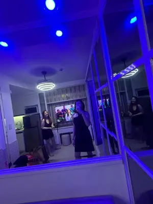 a woman taking a picture in a mirror in a kitchen at Esthetic vibes in Manila