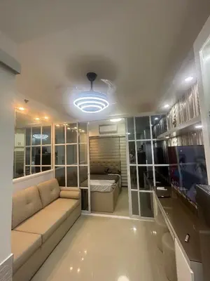 a living room with a couch and a bed at Esthetic vibes in Manila