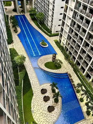 an overhead view of a swimming pool in a building at Cordial Condo in Manila