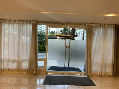 a room with a sliding glass door to a balcony at Shell Residence Pasay MOA with 2 Beds by G&K in Manila