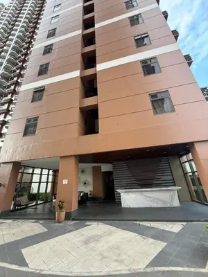 aominium building with a large building at 1-Bedroom Condo - Stunning Sunset at the City in Manila