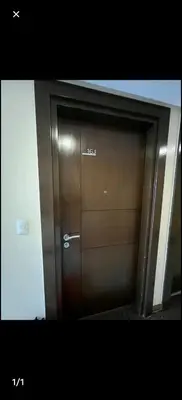 a pair of wooden doors in a building at McKinley Hills Taguig Haven in Manila