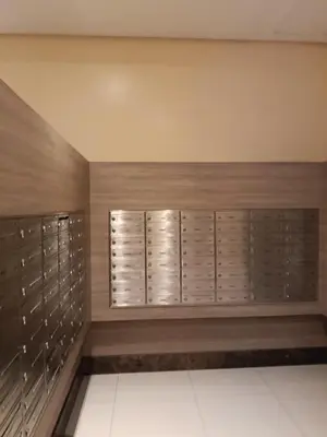 a walk in closet with wooden walls and lockers at McKinley Hills Taguig Haven in Manila