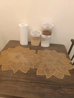 a table with toilet paper and two cups on it at McKinley Hills Taguig Haven in Manila
