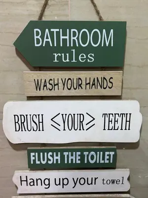 a group of signs that say bathroom rules wash your hands brush your teeth flush your at Seaside Stay in Manila