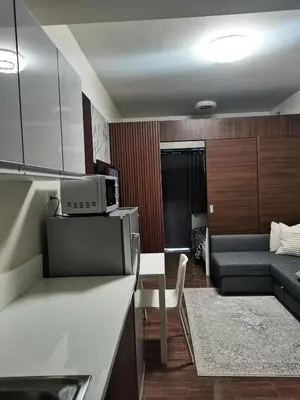 a kitchen and living room with a couch and a table at 