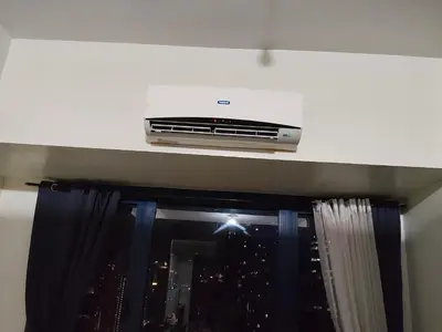 a air conditioner sitting on top of a window at Staycation condotel in Manila