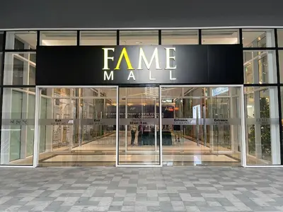 a store front of a mall with a sign on it at FAME Residences - The 37th Suite in Manila