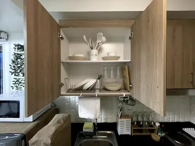 a kitchen with a sink and a microwave at Perfect Sunset View in Pasay Near MOA & NAIA in Manila