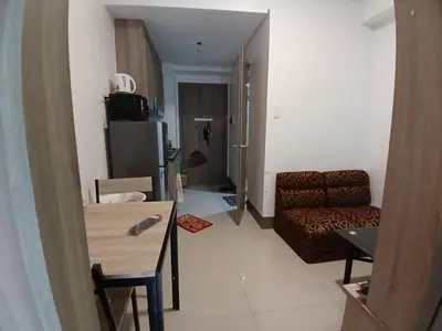 a living room with a couch and a table at Condo unit for rent in Manila