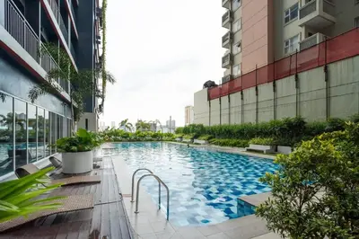 a swimming pool in the middle of a building at Boho Makati Condo w/ Wi-Fi + Workspace | Red in Manila