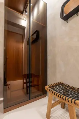 a glass shower with a bench in a room at Modern Industrial 1 BR | Condo | MOA Shore 3 NAIA in Manila