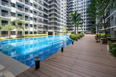 a large swimming pool in the middle of a building at Modern Industrial 1 BR | Condo | MOA Shore 3 NAIA in Manila