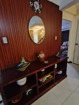 a room with a mirror and a wooden wall at David home in Manila