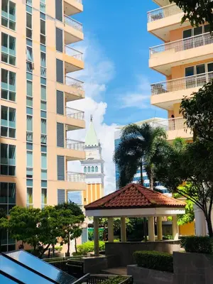 a gazebo in front of a tall building at Grand view Venice 1BR with balcony near BGC in Manila
