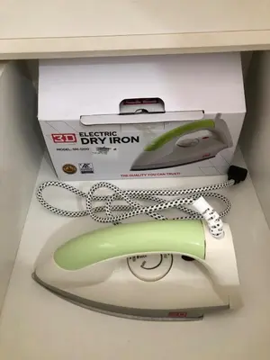 a green and white computer mouse in a box at Haven in Manila Venice 1BR with balcony near BGC in Manila