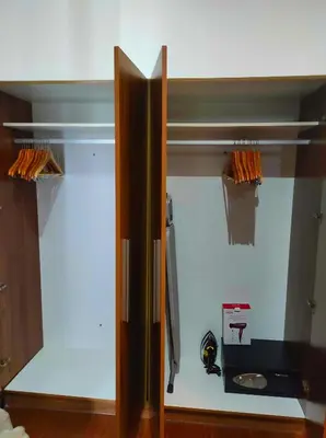 a room with a glass door with a sink in it at Big NEW 1 Bedroom corner unit with Balconies - FREE Sauna Pool Gym View of Skyline, Manila Bay, Sunset in Manila