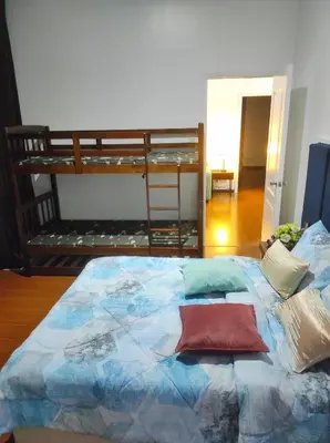 a bed in a room with a bunk bed at Big NEW 1 Bedroom corner unit with Balconies - FREE Sauna Pool Gym View of Skyline, Manila Bay, Sunset in Manila