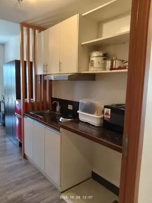 a kitchen with a sink and a counter top at Staycation at CJS in Manila
