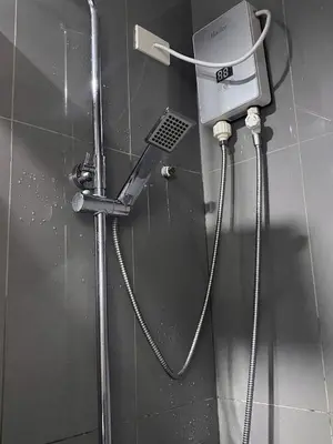a shower in a bathroom stall with a shower at Air Residences 46F Stunning View Wifi & Netflix in Manila