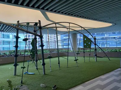 a playground in an office building with a swing at Air Residences 46F Stunning View Wifi & Netflix in Manila