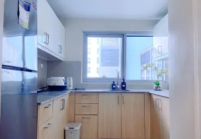 a kitchen with a sink and a window at 120 Sqm Modern 3 Bedrooms HighRise Facing Manila Bay Sunset, Near Manila Airports, Okada Casino, Solaire Casino, MOA with Free Parking in Manila