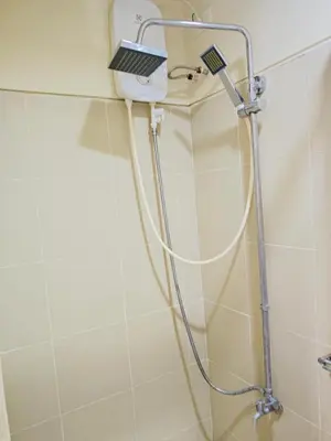 a shower with a laptop on top of it at Seren View Bedspace - S Residences in Manila