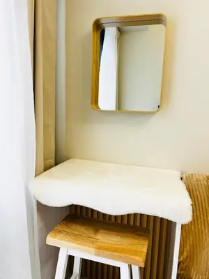 a mirror and a stool in a small room at MOA GRAND STAY Suite08 Newly Turn-over Only! in Manila