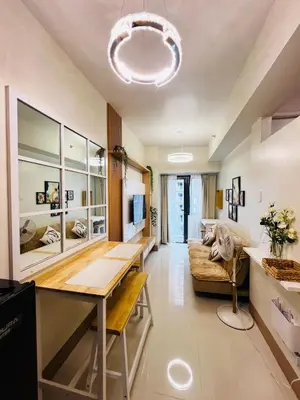 a living room with a table and a couch at MOA GRAND STAY Suite08 Newly Turn-over Only! in Manila