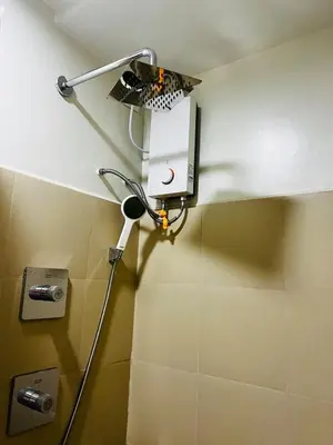 a light on the wall of a bathroom at MOA GRAND STAY Suite08 Newly Turn-over Only! in Manila