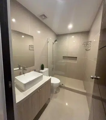 a bathroom with a sink and a toilet and a shower at 4 Bedroom House for 5-6 guests in Manila