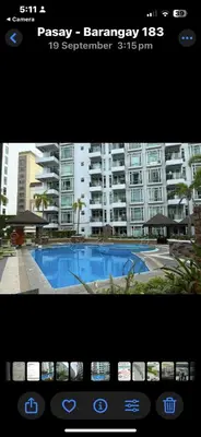 a view of a swimming pool in front of a building at Parkside Villas G NEWPORT Philippines in Manila