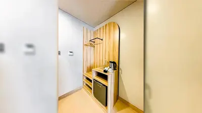 a hallway with a room with a wooden wall at Madison 101 Hotel + Tower in Manila