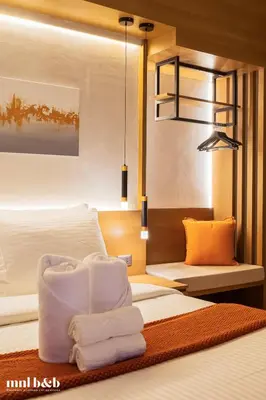 a hotel room with a bed with towels on it at Near Venice Mall! Hotel 1BR Unit in Viceroy Residences in Manila