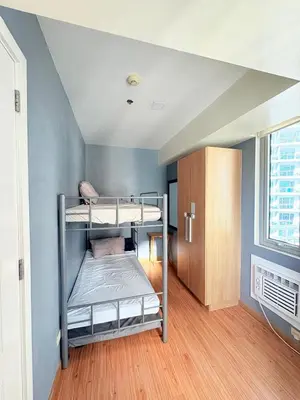 a bedroom with two bunk beds in a room at Azure Staycation by Casa Tremora Deluxe in Manila