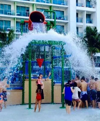 a group of people playing in a water park at Azure Urban Condomiun Near Airport in Manila