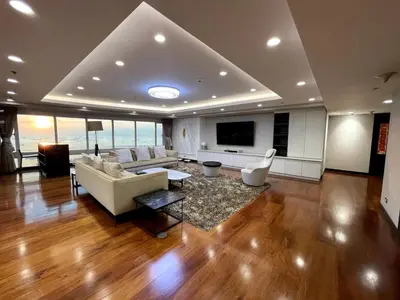a large living room with a couch and a tv at Ultra Luxury 5BR Penthouse in Manila Bay Rizal Park in Manila