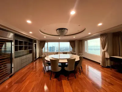 a dining room with a table and chairs at Ultra Luxury 5BR Penthouse in Manila Bay Rizal Park in Manila