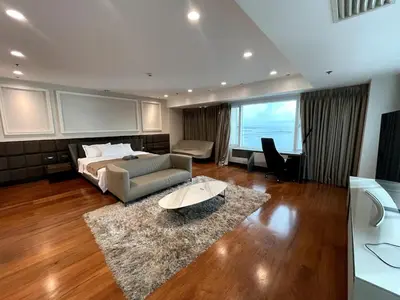 a bedroom with a bed and a couch and a table at Ultra Luxury 5BR Penthouse in Manila Bay Rizal Park in Manila