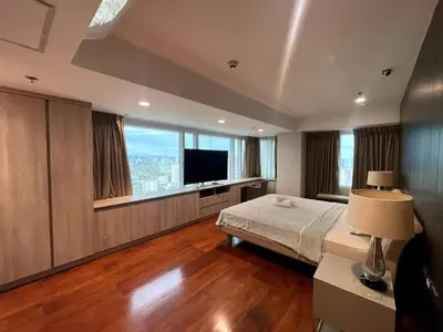 a large bedroom with a bed and a television at Ultra Luxury 5BR Penthouse in Manila Bay Rizal Park in Manila