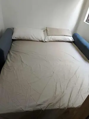 a bed with two pillows on top of it at Marhulz Two Bedroom Staycation at S Residences in Manila