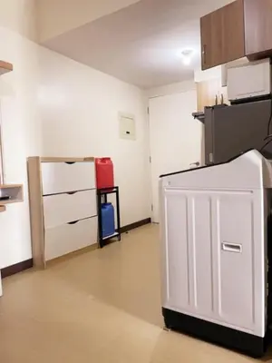 a kitchen with a white refrigerator in a room at Torre de Manila Taft Avenue near Luneta Park US Embassy Intramuros Ermita Manila in Manila